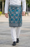 Person wearing a traditional outfit Sampin Instant Kasturi Teal Blue traditional tenun pattern instant sampin outdoor background
