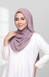 Woman wearing a Semi Instant Shawl Plain Smokey Purple hijab against a white background