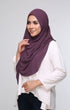 Woman wearing Dusty Magenta Semi Instant shawl Plain showing smooth fall and generous width chiffon and Shirt white top on a light gray background