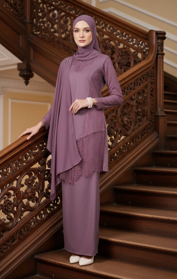 Woman in a Kebaya Moden Dusty Magenta side view on model highlighting long sleeves and fit standing on a wooden staircase with intricate carvings.