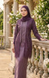 Woman wearing kebaya Kutu Baru Dusty Magenta front view showing V‑neck collar and French lace detailing standing on a stone balcony with floral decorations.