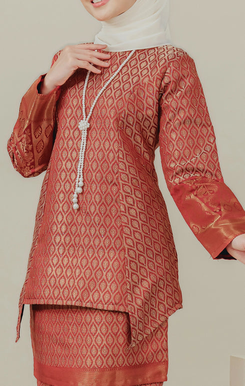 Fabric close up C Luxe Kurung Kedah Maroon showing dyed brocade texture and pattern