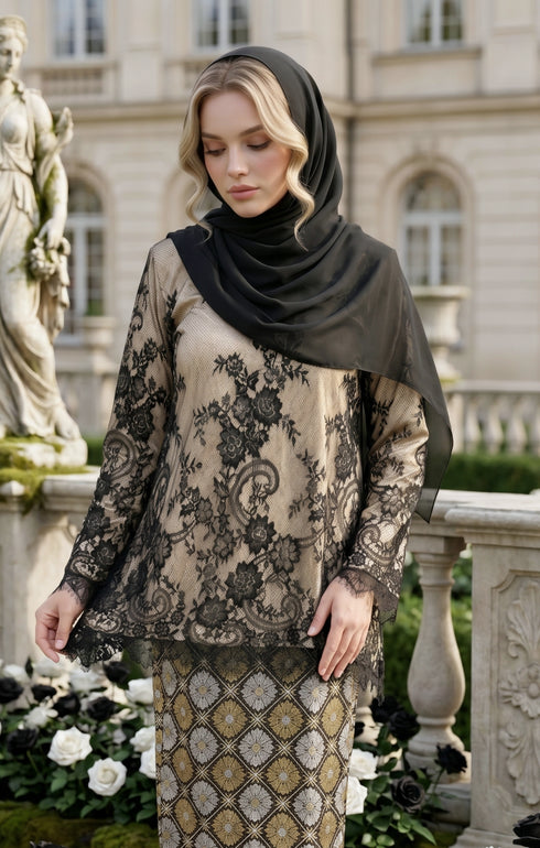 model styling Kurung Kedah Lace Songket Black highlighting French lace and woven texture