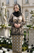 woman standing in Kurung Kedah Lace Songket Black displaying shoulder pad detail and elegant fit