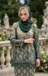 woman wearing Kurung Kedah Lace Songket Emerald Green showing shoulder pad detail and elegant fit