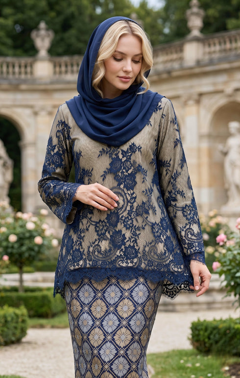 woman standing in Kurung Kedah Lace Songket Blue Black displaying shoulder pad detail and elegant fit