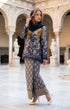 woman posing in Kurung Kedah Lace Songket Blue Black featuring full songket skirt styling