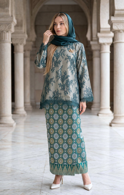 woman wearing Kurung Kedah Lace Songket Teal Green showing shoulder pad detail and elegant fit