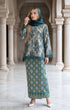 woman wearing Kurung Kedah Lace Songket Teal Green showing shoulder pad detail and elegant fit