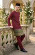 Baju Melayu Teluk Belanga Maroon side view showing sleeve and fit in the background in an outdoor setting.