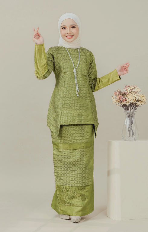Model wearing C Luxe Kurung Kedah Olive displaying overall drape and styling