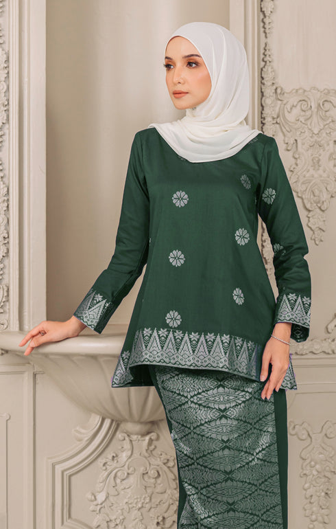 Fabric close up Kurung Kedah Dark Emerald Green Silver showing woven songket texture and silver highlights