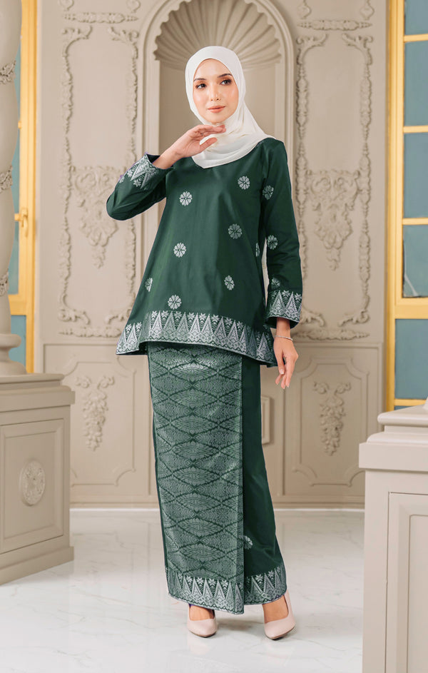 Model wearing Aryana Kurung Kedah Dark Emerald Green Silver displaying overall styling and drape