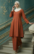 Woman in a Kebarung Klasik Plain Brick Orange front view outfit