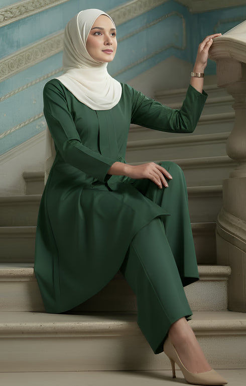 kebarung klasik plain Dark Emerald Green angled side view showing flowy kebarung klasik fit sitting on a staircase.