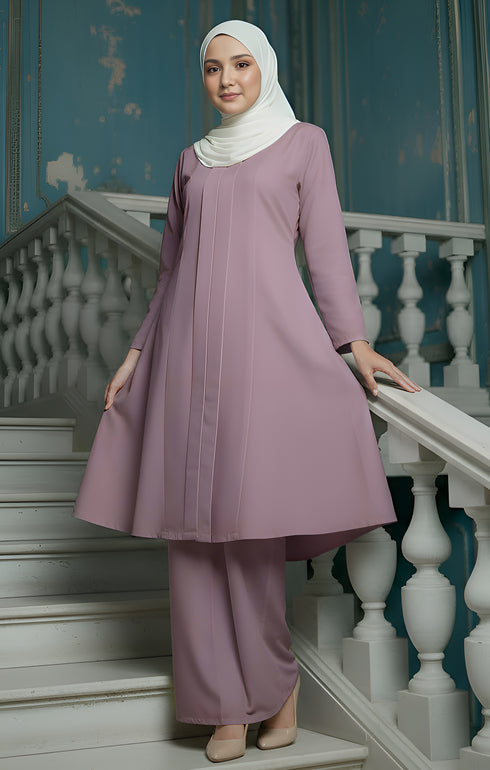 Kebarung Klasik Smokey Purple front view with V neck and labuh design with a blue wall background