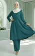 Kebarung Klasik Teal Green front view model wearing V neck labuh design in a decorated room.