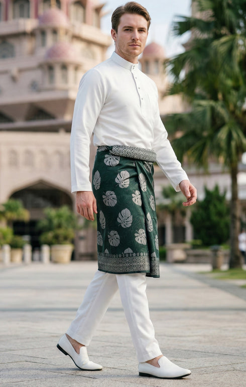 Man wearing Sampin Instant Kasturi Tenun Emerald Green Silver with Baju Melayu traditional outfit front view highlighting velcro waist and weave texture while walking on the street