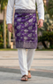 Man wearing Sampin Instant Raya Tenun Purple Silver with Baju Melayu traditional outfit front view showing purple and silver pattern contrast outdoors.