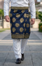 Man wearing Sampin Instant Kasturi Tenun Navy Blue Gold with Baju Melayu traditional outfit close-up showing embossed tenun fabric detail