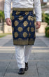 Man wearing Sampin Instant Kasturi Tenun Navy Blue Gold with Baju Melayu traditional outfit close-up showing embossed tenun fabric detail