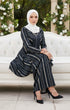 Model wearing Liyana 2.0 Kebarung Linen Black Stripe D5-3 displaying full drape and styling