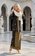 woman wearing Kebaya Kurung Moden Songket Black Gold posing outdoors in full outfit