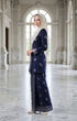 Woman in a Kebaya Kurung Moden Songket Blue Black Silver angled side view showing elegant silhouette
