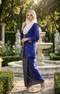 woman wearing Kebaya Kurung Moden Songket Dark Royal Blue Gold posing outdoors in full outfit