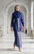 Woman in a Kebaya Kurung Moden Songket Royal Blue Silver traditional outfit standing in a marble hallway