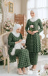 Model wearing Aruna Kebarung Linen Emerald Green Check D4‑1 displaying overall drape and styling