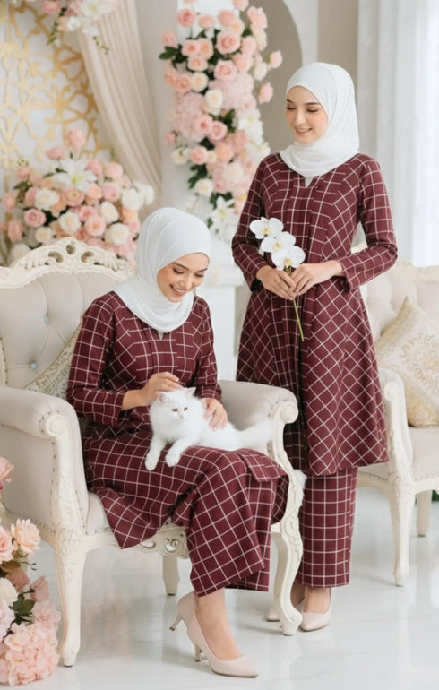 Model wearing Front view Aruna Kebarung Linen Maroon Check D4‑5 showing classic long kebarung design