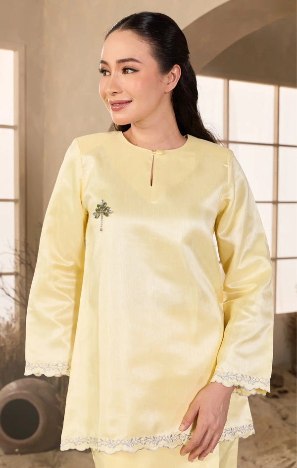 Soft yellow Kurung Kedah fabric close-up