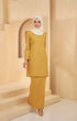 Model walking in Kurung Moden Plain Mustard, showing full kurung shape and plain design