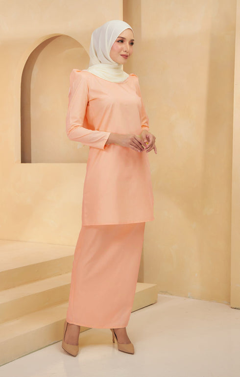 Kurung Moden Plain Peach styling shot showing long straight sleeves
