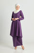 Woman wearing Luna Kebarung Klasik Dark Purple, front view on model. Features V-neck, long straight sleeves, back zip, and plain design in breathable German cotton.