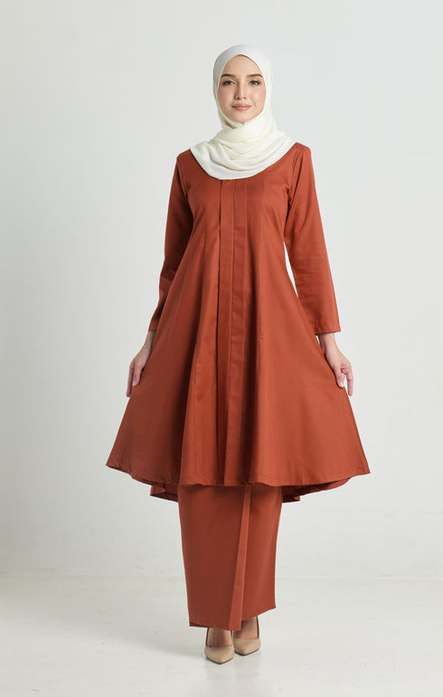 Kebarung Klasik Brick Orange flat lay showing full garment shape and plain pattern