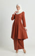 Kebarung Klasik Brick Orange front view on model showing V‑neck and full kebarung design