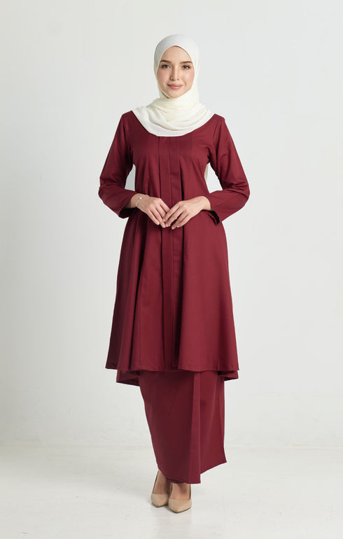 A woman wearing a Kebarung Klasik Dark Maroon front view on model with V‑neck and long straight sleeves traditional kebarung klasik outfit