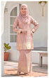 Model wearing Kurung Moden Baby Pink full outfit showing structured shoulder pad fit